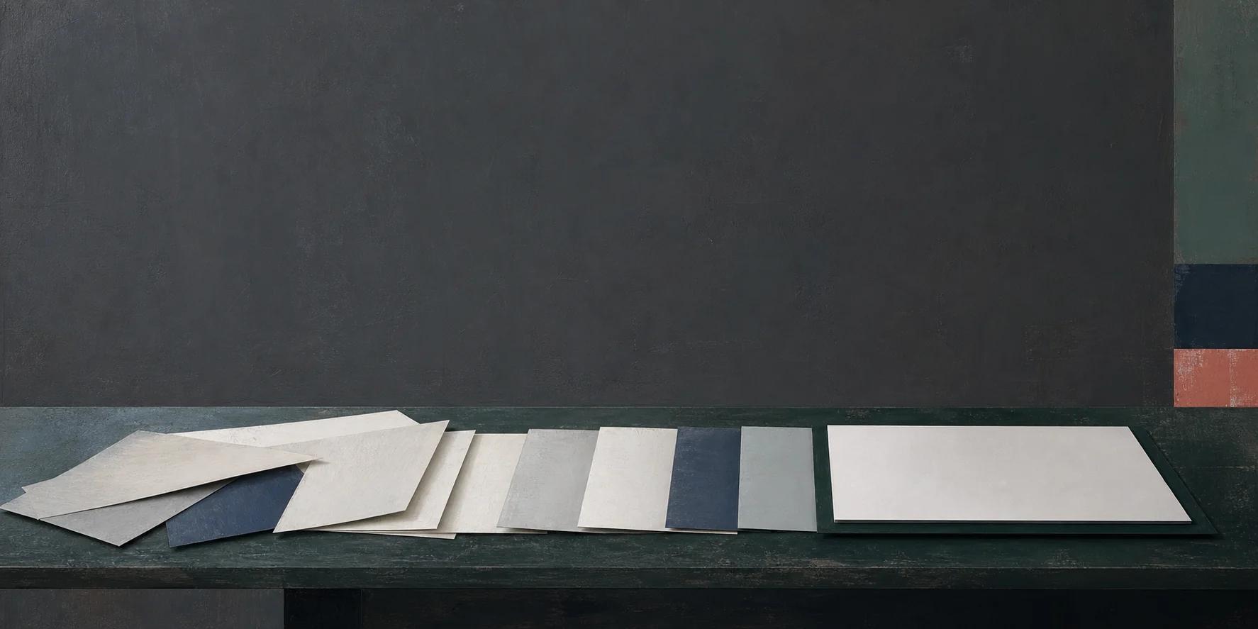 Paper forms aligned on a charcoal field