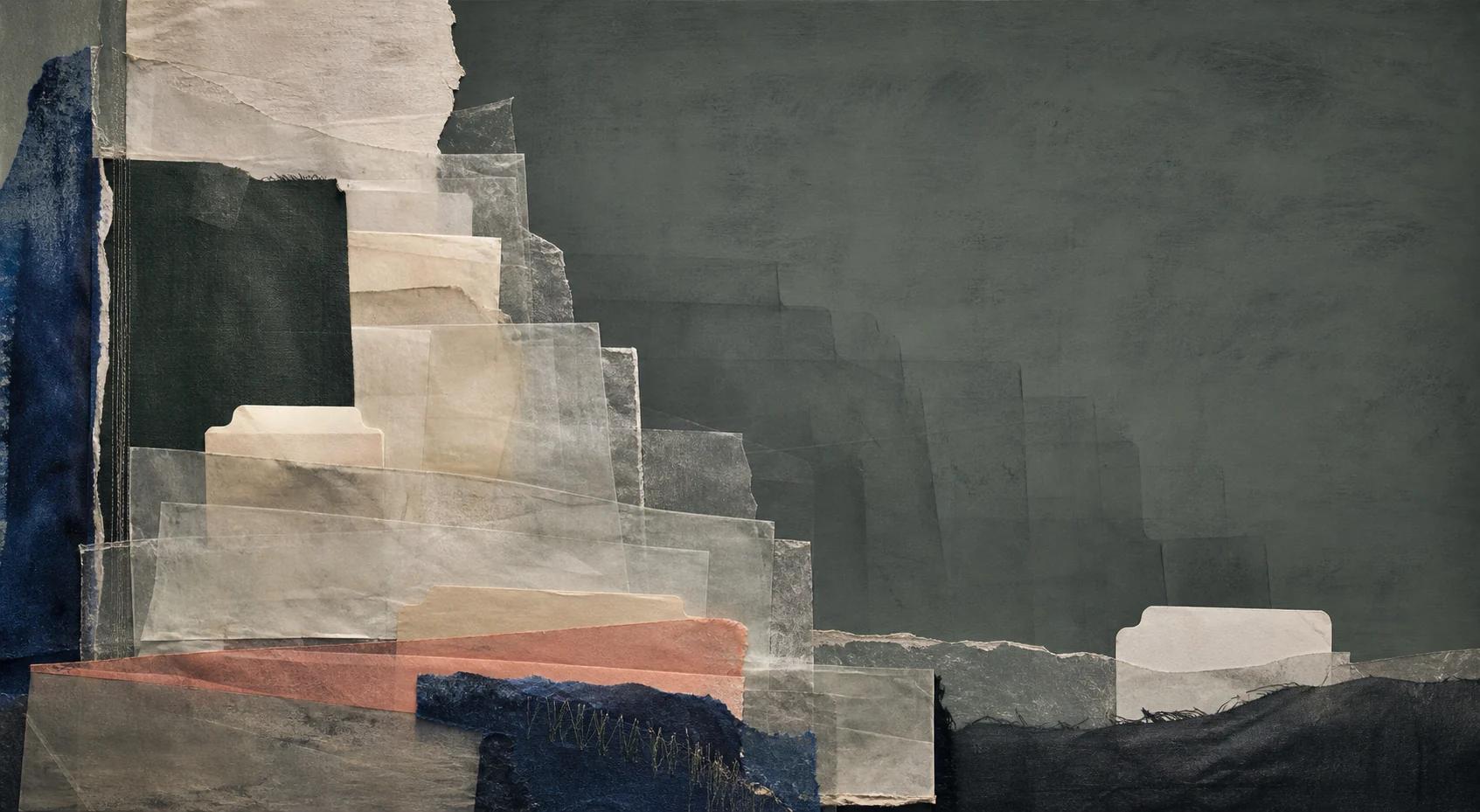 Layered paper folders on a dark work surface